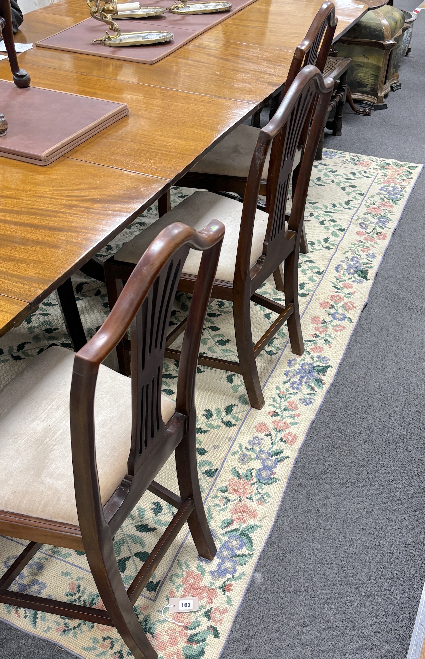 A set of six Hepplewhite style mahogany dining chairs, all singles